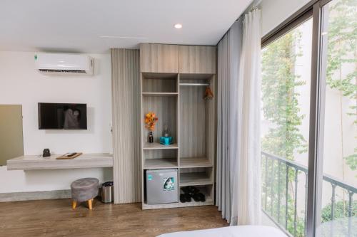 TV a/nebo společenská místnost v ubytování Tò Vò Hostel Nguyễn Công Trứ