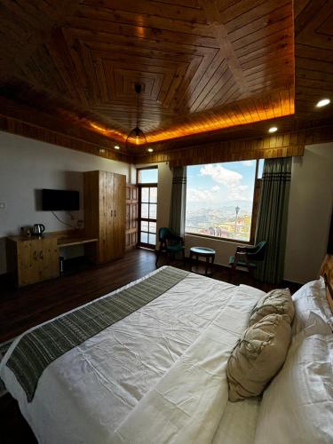 Ένα ή περισσότερα κρεβάτια σε δωμάτιο στο Hilly Horizon BnB Kufri