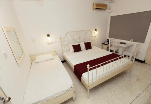 Una cama o camas en una habitación de Beverly Villa