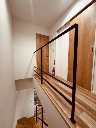 a staircase in a house with a window at Niseko Purr 101 in Kutchan