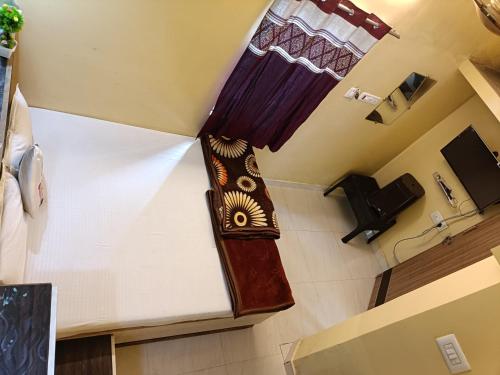 TV a/nebo společenská místnost v ubytování Amudha Hotels & Restaurant