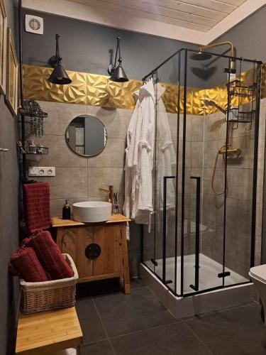 a bathroom with a shower and a sink at Apartament w Fabryce Czekolady in Bytom