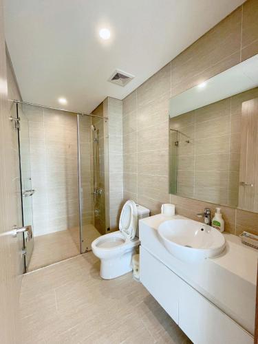 a bathroom with a toilet and a sink and a shower at 2BR 69m2 Beautiful view at Vinhomes Grand Park in Gò Công