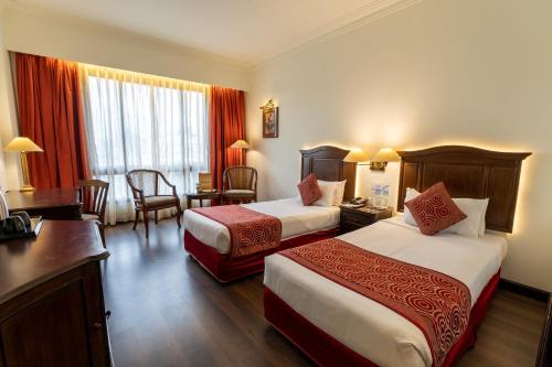 Postel nebo postele na pokoji v ubytování Grand Hotel Kathmandu