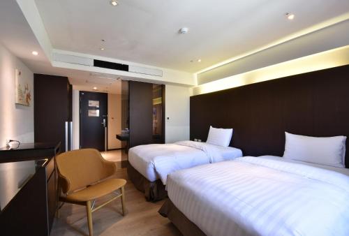 Postel nebo postele na pokoji v ubytování HOTEL HI- Chui-Yang