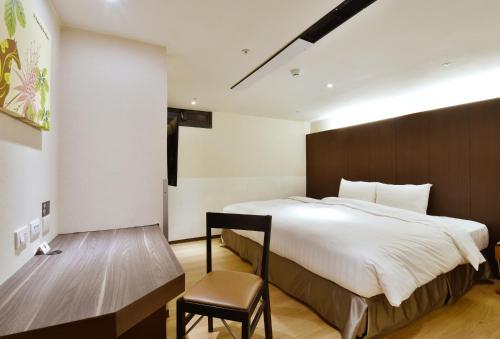 Postel nebo postele na pokoji v ubytování HOTEL HI- Chui-Yang