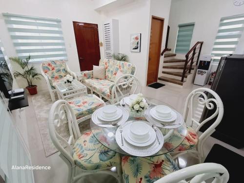 a dining room with a table and chairs at Vacation Home near Panglao Airport and White Sand Beaches in Biking
