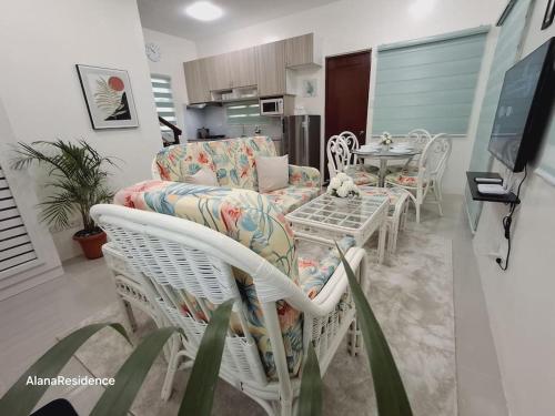 a living room with a couch and a table at Vacation Home near Panglao Airport and White Sand Beaches in Biking