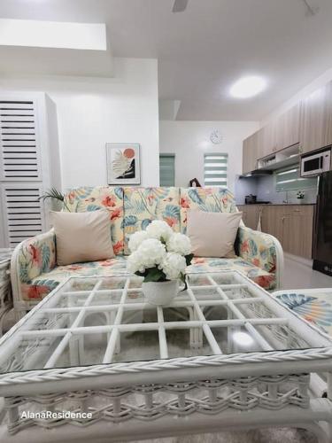 a living room with a couch and a coffee table at Vacation Home near Panglao Airport and White Sand Beaches in Biking