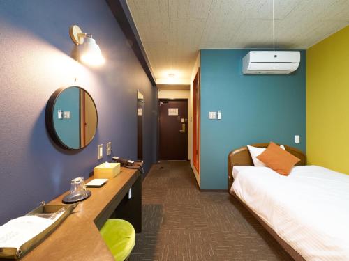 Postel nebo postele na pokoji v ubytování Hotel Village