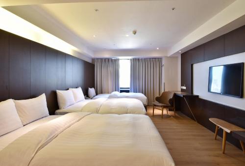 Postel nebo postele na pokoji v ubytování HOTEL HI- Chui-Yang