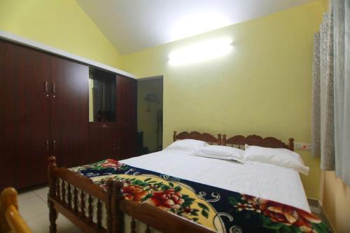 Postel nebo postele na pokoji v ubytování Modayil House - Anakkara