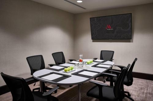 a conference room with a table with chairs and a chalkboard at Washington Marriott at Metro Center in Washington