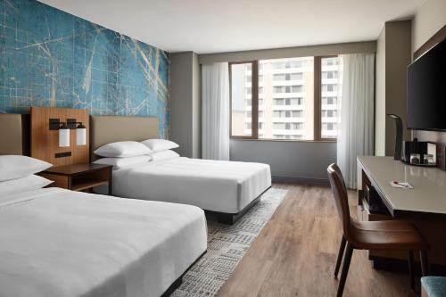 a hotel room with two beds and a desk at Washington Marriott at Metro Center in Washington, D.C.