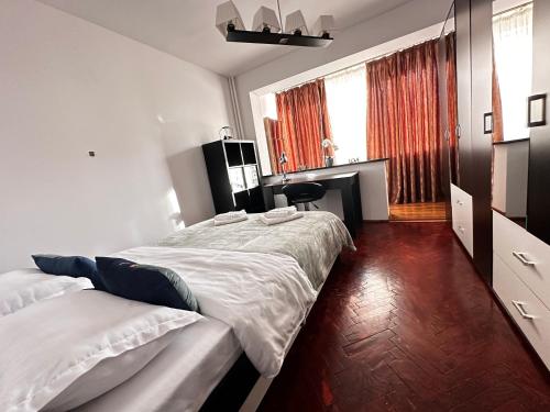 a bedroom with two beds and a fireplace in it at Fortress View Apartment in Timişoara