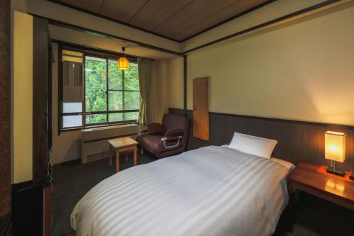 Postel nebo postele na pokoji v ubytování Takamiya Hotel Hammond