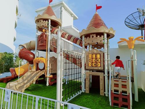 a playground at a resort with a slide at Shama Yen-Akat Bangkok in Bangkok