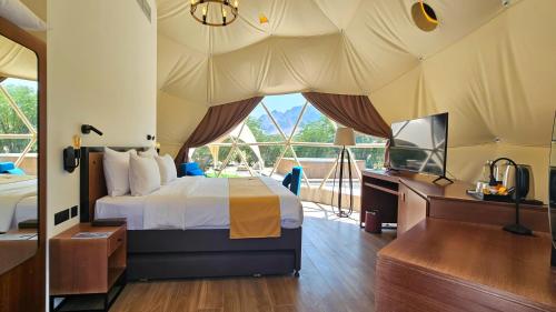 Ένα ή περισσότερα κρεβάτια σε δωμάτιο στο Hatta Resorts