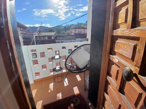 a view from a door of a balcony with a fan at La casa del patio in La Arboleda