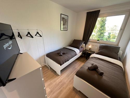 Кровать или кровати в номере Gemütliche Monteurs- und Geschäftsreisendenwohnung in Lengerich