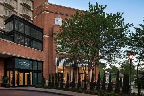 a brick building with a tree in front of it at The Ritz-Carlton, St. Louis in Clayton