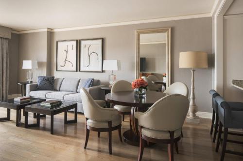 a living room with a couch and a table at The Ritz-Carlton, St. Louis in Clayton