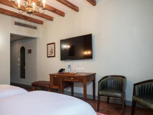 Vila Ebel Hotel Pool & Spaにあるテレビまたはエンターテインメントセンター