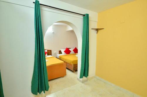 Ένα ή περισσότερα κρεβάτια σε δωμάτιο στο Estay SK Residency