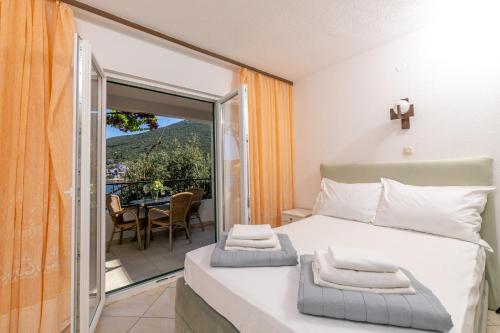 Posteľ alebo postele v izbe v ubytovaní Apartmani Ružica