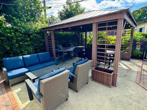 a gazebo with a couch and a table and chairs at 弓ヶ浜海水浴場徒歩1分! 一棟貸別荘! Yumigahama Beach House & BBQ! in Minamiizu
