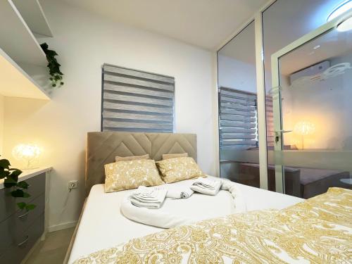a bedroom with two beds and a window at The Maze Apartment in Ljubljana