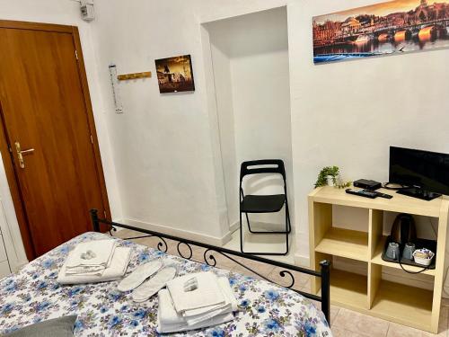 a bedroom with a bed with a phone on it at B&B Da Lisa in Turin