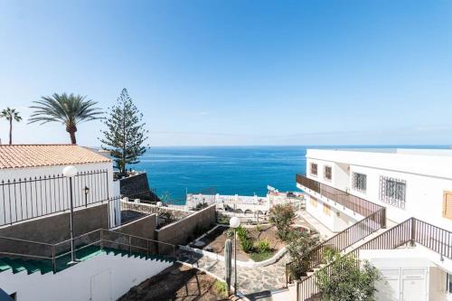 a view of the ocean from a building at Almodo Suite Patalavaca in Patalavaca