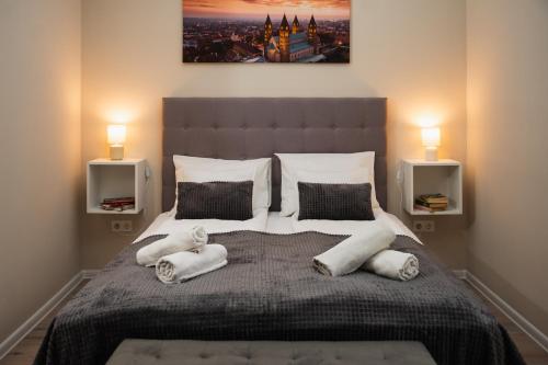 Postel nebo postele na pokoji v ubytování H30 Apartman