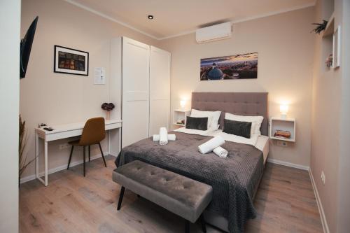 Postel nebo postele na pokoji v ubytování H30 Apartman