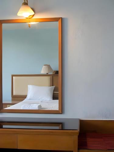 Ένα ή περισσότερα κρεβάτια σε δωμάτιο στο X Wish Inn BTS Chidlom - วิช อินน์ บีทีเอส ชิดลม