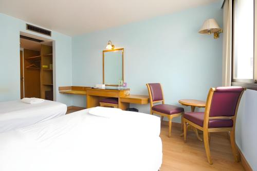 Ένα ή περισσότερα κρεβάτια σε δωμάτιο στο X Wish Inn BTS Chidlom - วิช อินน์ บีทีเอส ชิดลม