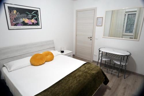 a bedroom with a bed with a stuffed animal on it at Appia Antica Guest House in Rome