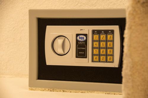 a microwave oven with a remote control in it at Fontarcella, Heart & Roots in Petrignano sul Lago