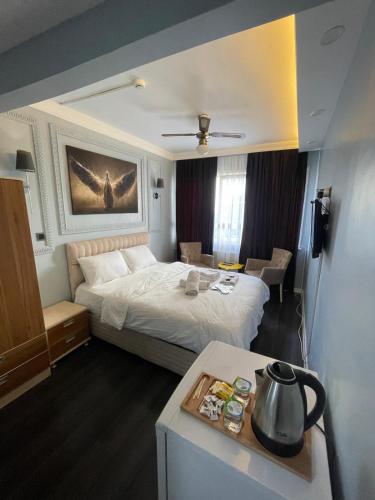 Katil atau katil-katil dalam bilik di Kıyı Butik Otel