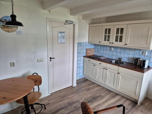 Кухня или мини-кухня в De Welvaart - Logement
