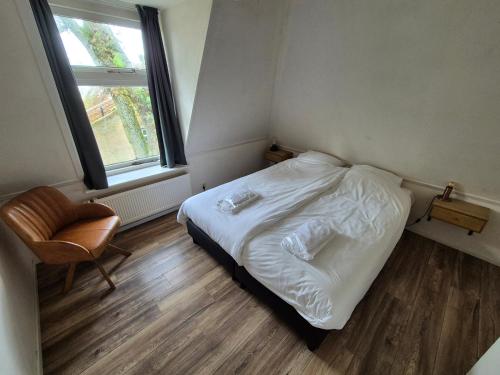 Кровать или кровати в номере De Welvaart - Logement