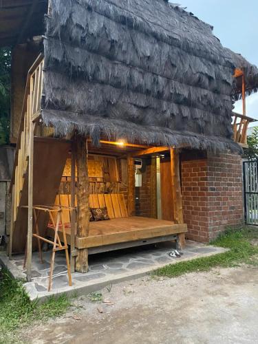 a house that is made out of wood at Upus Homestay in Tetebatu