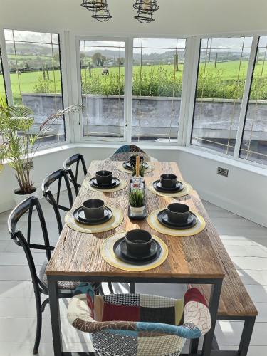 a wooden table with plates of food on it at The Blue Door in Letterkenny