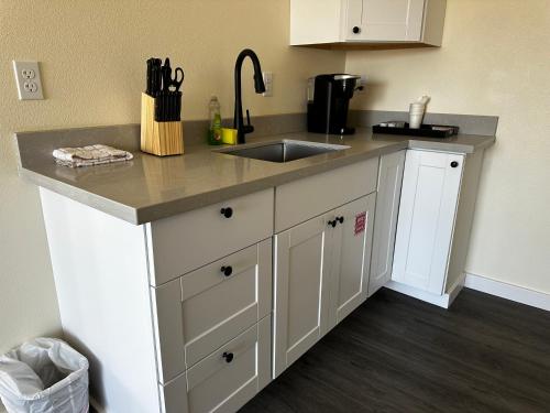 a kitchen with a sink and a counter at Dock Street Inn in Westport