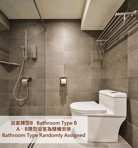 a bathroom with a toilet and a shower at Brown House Hotel - Taipei Main Station in Taipei