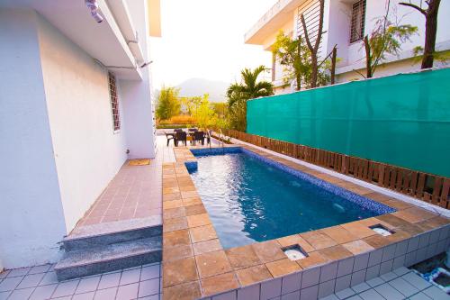 Bazén v ubytování Woods by Mizzle Exotica Premium Villas nebo v jeho okolí