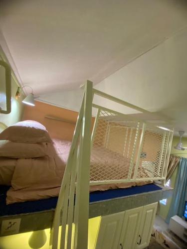 a bedroom with a bunk bed in a room at Seri Idaman Room and Studio - MusIim Only in Kampong Gaung