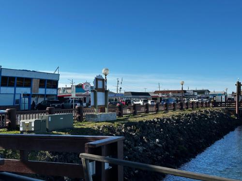 a body of water with a fence and a river at Dock Street Inn in Westport