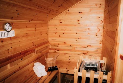 a sauna with a clock on the wall at Seaview Guesthouse in Rostrevor